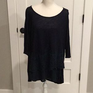 Solid blue top with appliqués
